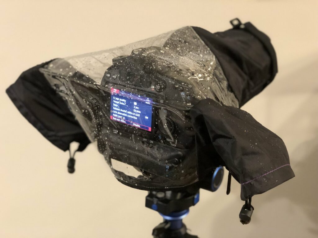 The dslr rain cover keeps your camera dry, while letting you see and use the camera.