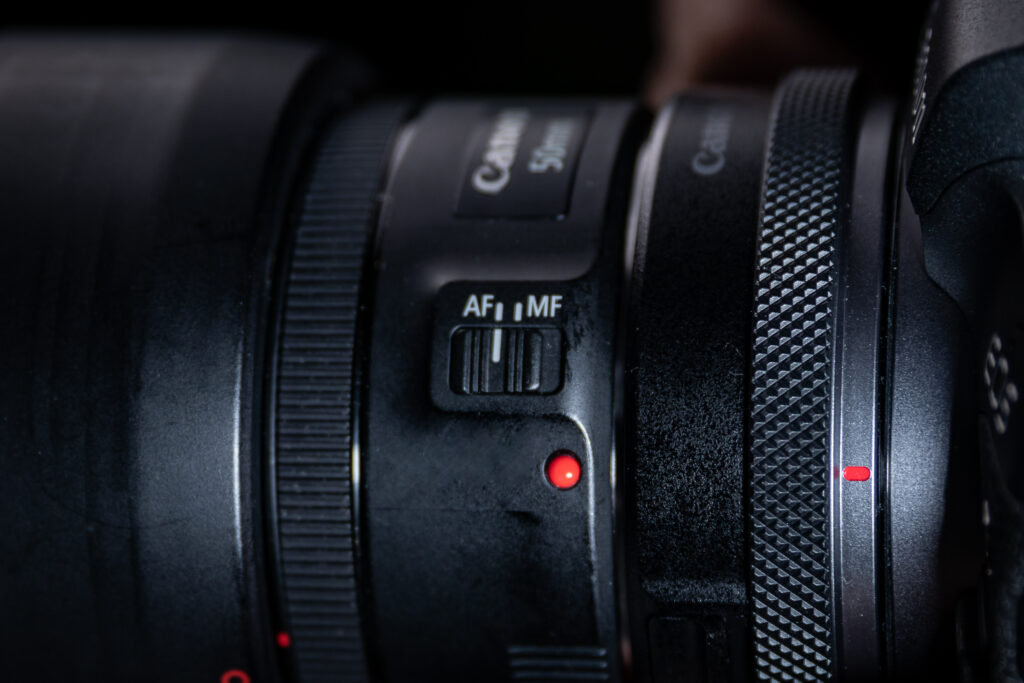 Image of a Canon camera lens featuring the AF-MF switch.