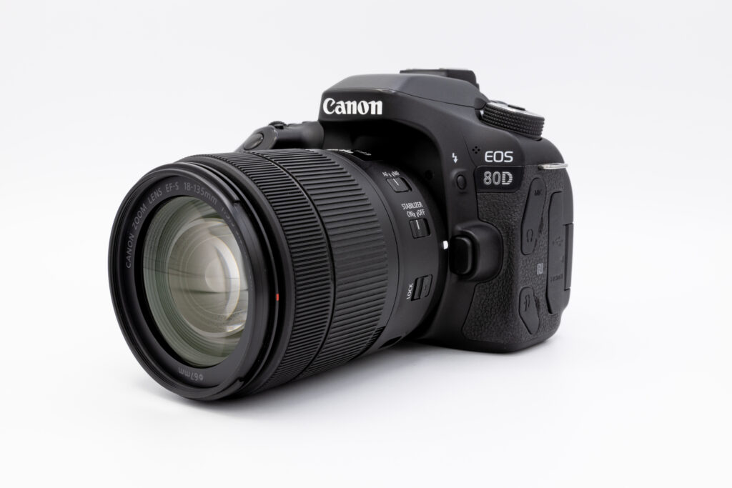 Image of a Canon 80D camera with a kit lens attached.