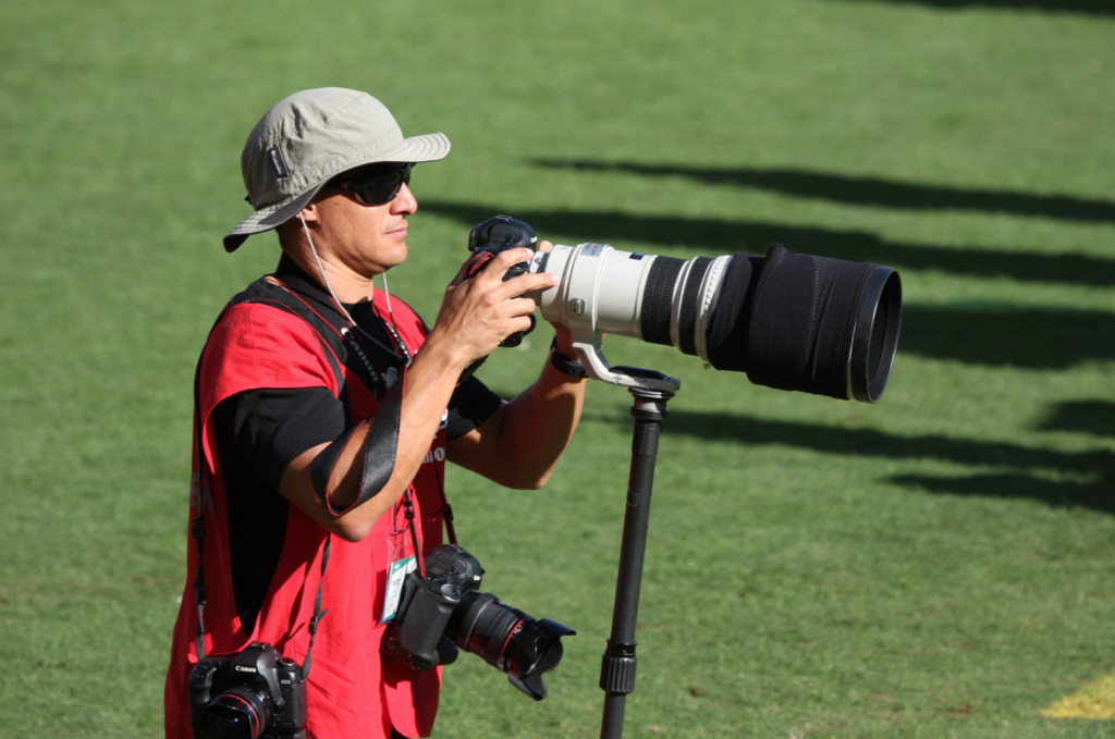 NFL Photographer with massive super telephoto lens and multiple cameras