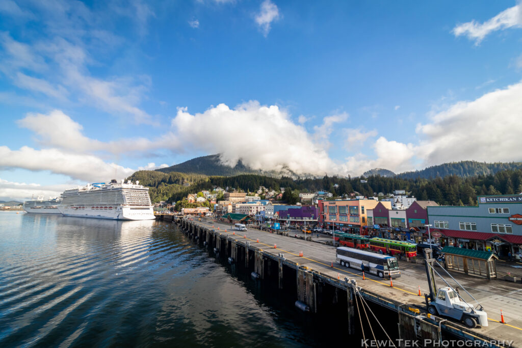 Very wide angle view of a cruise ship at an Alaskan ship terminal.