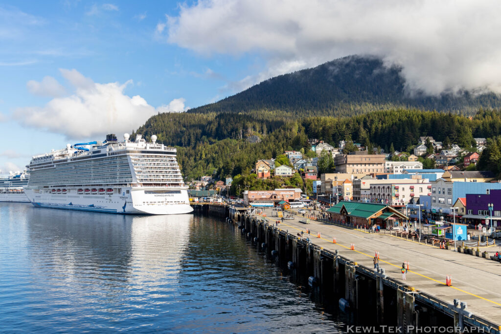Wide view of a cruise ship at an Alaskan ship terminal.