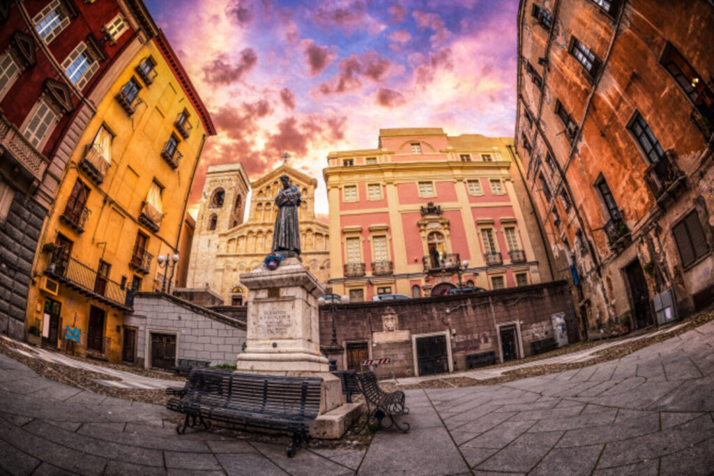 Image of a statue in a town square seen through a fisheye lens.