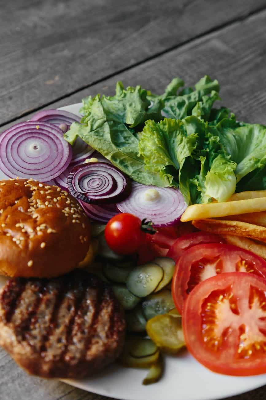 ingredients of a burger on a white plate