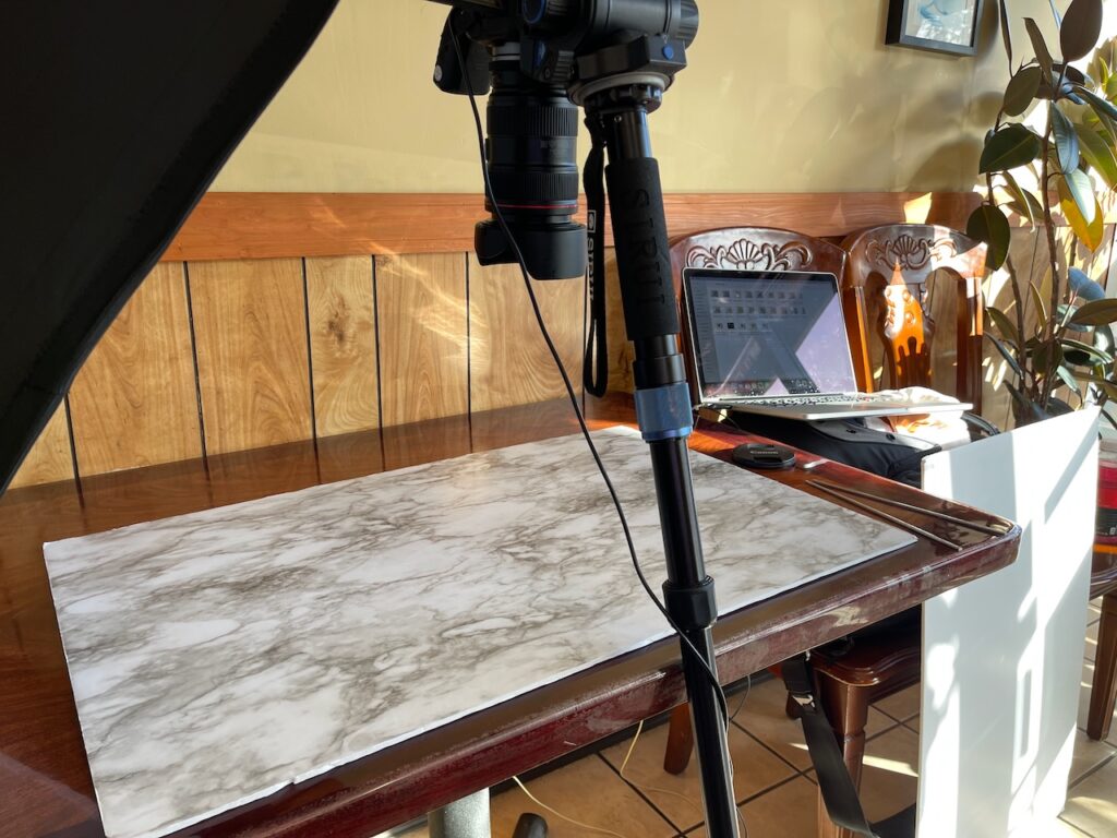 Olympia food photographer behind the scenes on location at a restaurant