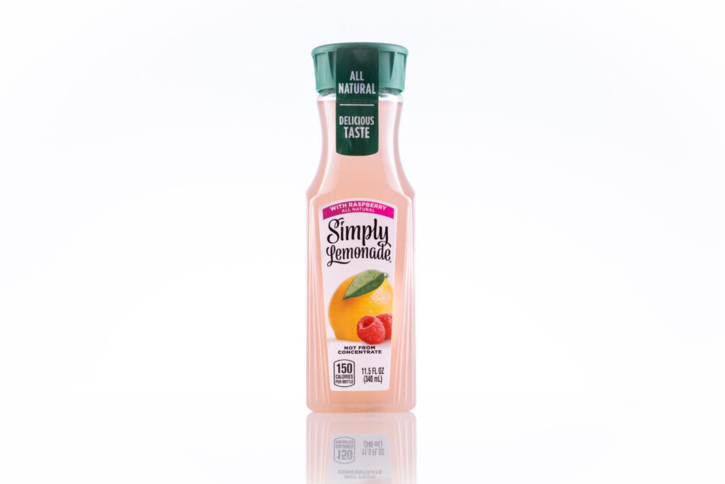 pack shot of juice bottle on white surface and background