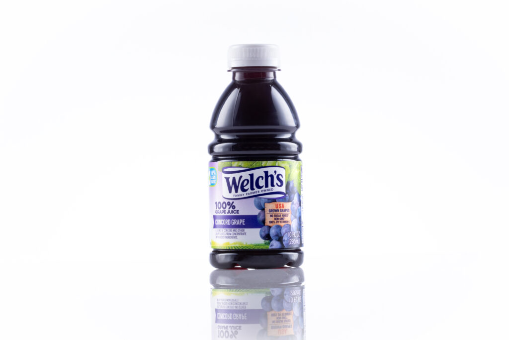 pack shot of juice bottle on white surface and background