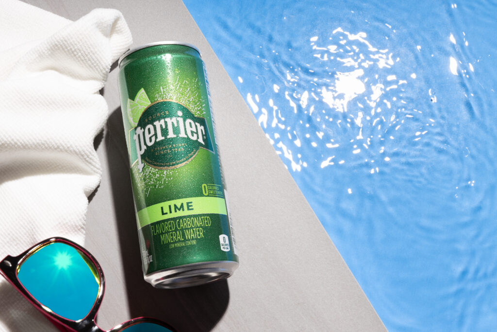 Perrier drink can next to pool