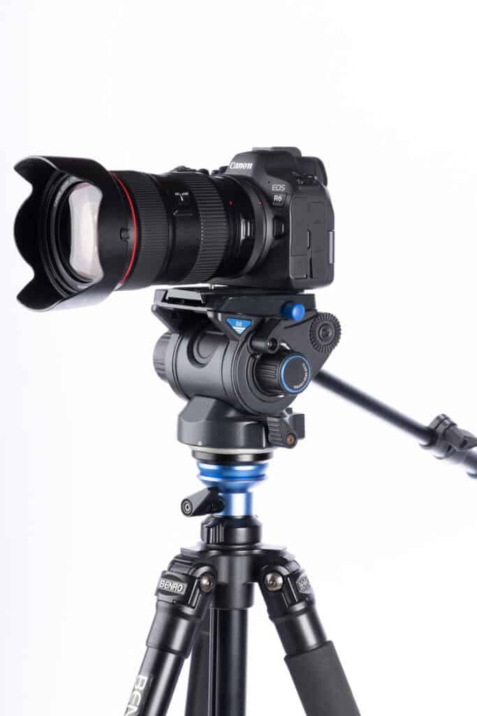 Mirrorless camera mounted on the Benro A2573FS6 tripod with S6 PRO fluid head, demonstrating smooth panning capability and stable support.
